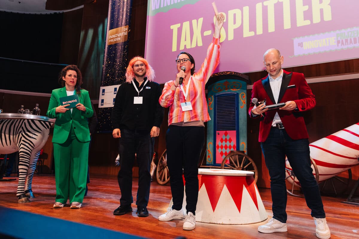 Tax Splitter team on stage at TivoliVredenburg receiving the Innovation Award from the Dutch Ministry of Finance